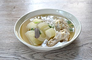 boiled winter melon drumstick chicken with mushroom soup on plate