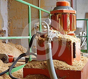 Boiler room hydraulic system supplying wood sawdust photo