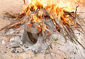 Boiling the billy on camp fire. Australia.