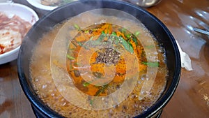 Boiling blood suasage red soup with pig's ear local Korean food soondae hot stew