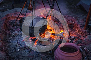 Boiling cauldron with mysterious decoction at Kupala Night