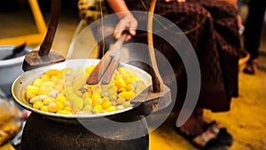 Boiling the Cocoon in a pot.