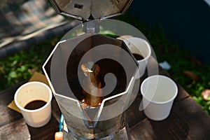 Boiling coffee by Moka pot
