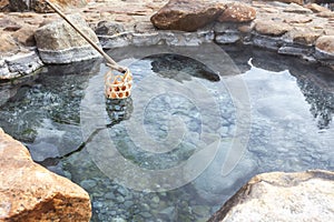 Boiling eggs in the hot spring, Thailand