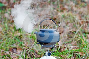 Boiling kettle in outback setting