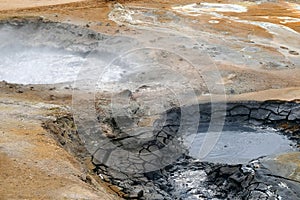 Boiling mud pots in the geothermal area of Iceland