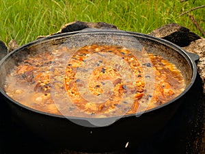 Boiling pilau on the fire