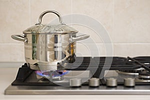 Boiling pot on the gas stove fire