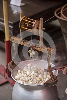 Boiling silkworm cocoon in pot