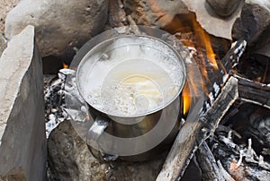 Boiling soup on a campfire