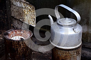 Boiling tea kettle in a simple street kitchen
