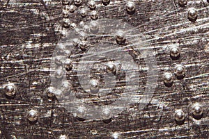 Boiling water bubbles close up. abstract texture with water drops on metal plate. gray rough background