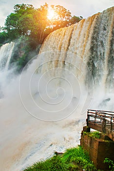 Boiling water foam, crashing and falling jets, a fine mist over the water. The most high-water waterfall in the world - Iguazu.
