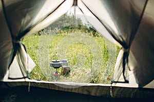 Boiling water in kettle on portable camping stove