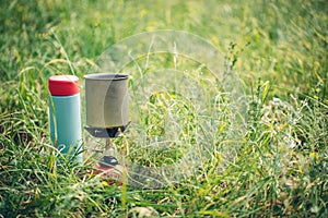 Boiling water in kettle on portable camping stove