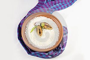 Boishakh panta ilish with green chilli and onion. Panta bhat is popular among Bengali\'