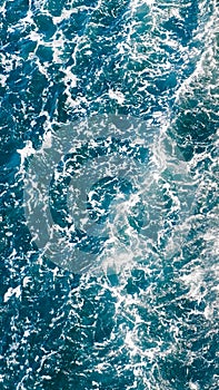 Boisterous waves background top view photo