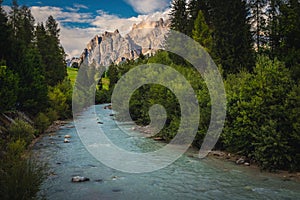 Boite river and high mountains at sunset, Dolomites, Italy