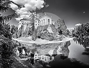 Bojnice castle is mirrored in water, Slovakia, colorless