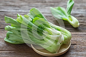 Bok choy chinese cabbage on wooden table.