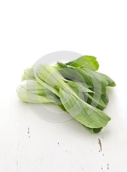 Bok choy on white rustic table