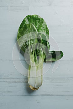 bok choy on a white wooden surface photo