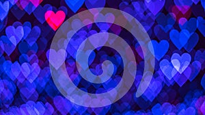 Bokeh background with blue and pink hearts on black background. Love concept. Theme for Valentine\'s Day