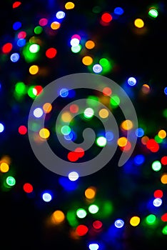 Bokeh of blurred Christmas lights - all colours - green, blue, orange, white, red