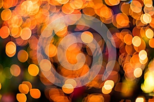 Bokeh blurred lights orange round lot.