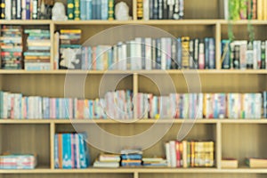 Bokeh blurry background of many book shelves library room in school or college. Abstract background for education concept