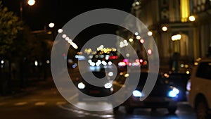 Bokeh of cars and blurred traffic lights.