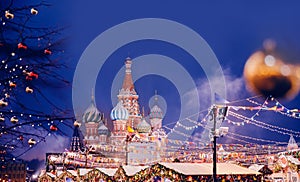 Bokeh christmas light of lanterns on winter night banner St. Basil Cathedral on Red Square in Moscow