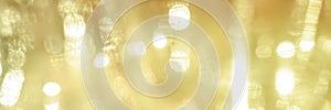 Bokeh circle with gold sparkles background. Yellow glitter backdrop. Gold