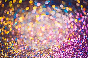 Bokeh effect glitter colorful blurred abstract background for birthday, anniversary, wedding, new year eve or Christmas