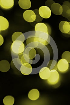 Bokeh effect golden yellow defocused light background. Christmas Lights Concept