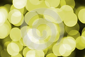 Bokeh effect golden yellow defocused light background. Christmas Lights Concept