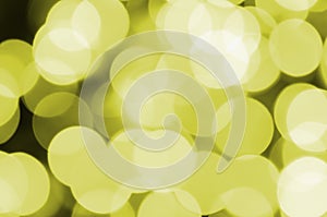 Bokeh effect golden yellow defocused light background. Christmas Lights Concept