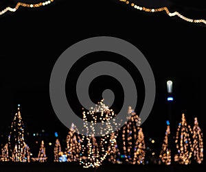 Bokeh for a festive New Year and Christmas background. Defocused abstract beige, yellow, white and blue light circles.