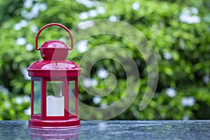 Bokeh Green Background and Red Lantern for Ramadan kareem and Eid greeting cards