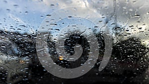 Bokeh, rain, water drops. Rainy day. Car flashlights defocused photo