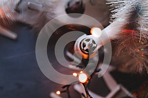 Bokeh, selective focus, Best Christmas pressent, gift Drone on a gray wooden table background. lights bokeh, top view, Christmas