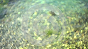 Bokeh sun reflected flare on water surface, Abstract blurred lights with bokeh at the seaside, Sparkling circular