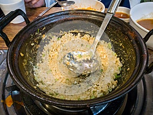 Bokkeum-bap, or fried rice. Korean dish made by stir-frying rice with other ingredients such as seaweed flake in sesame oil.