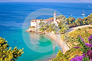 Bol on Brac island. Monastery on pebble beach in Bol view photo