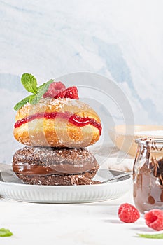 Bolas de Berlim, or `Berlin Balls`. Portuguese fried dough with sugar, Filled with chocolate or raspberry jam. Portuguese fried photo