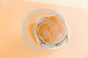 Bolas de Berlim, Berliner or donuts filled with egg jam, a very popular dessert in Portuguese pastry shops photo