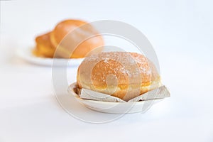 Bolas de Berlim, Berliner or donuts filled with egg jam, a very popular dessert in Portuguese pastry shops photo