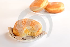 Bolas de Berlim, Berliner or donuts filled with egg jam, a very popular dessert in Portuguese pastry shops photo