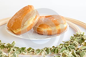 Bolas de Berlim, Berliner or donuts filled with egg jam, a very popular dessert in Portuguese pastry shops photo