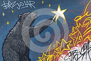 a bold and expressive painting in Basquiat-style, depicting a rawly sketched, powerful bear holding a brightly glowing star in its photo